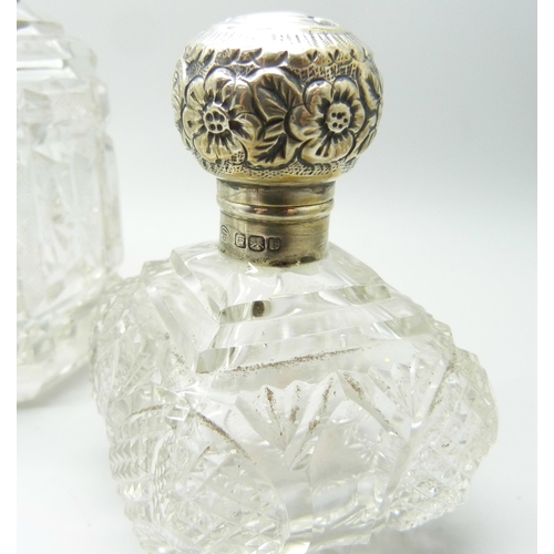 863 - A silver mounted cut glass scent bottle in the shape of a bell, Birmingham 1902, two other silver mo... 