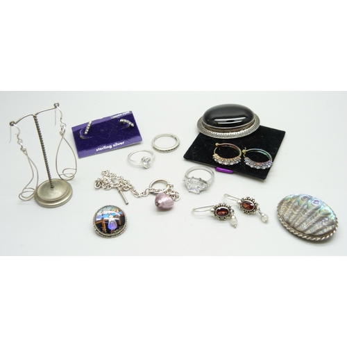 873 - Silver brooches including butterfly wings, earrings, silver rings, etc.