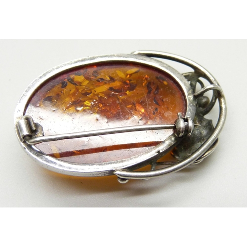 875 - A silver and amber brooch and bracelet