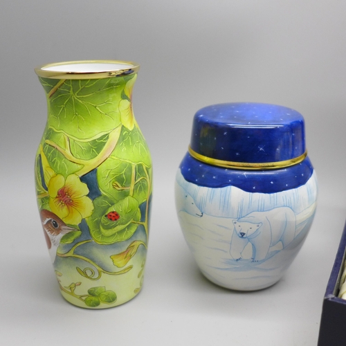 887 - Four Moorcroft enamels, Dolphin & Manatee pill box, 31/75, boxed, Hummingbird, boxed, vase decorated... 