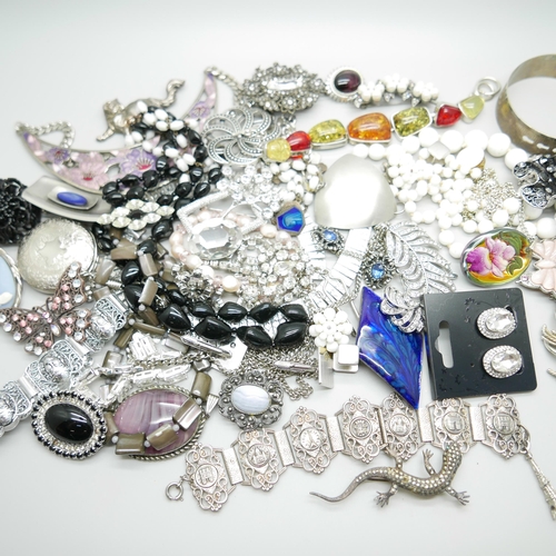 897 - A collection of costume jewellery including a silver bangle, 23g