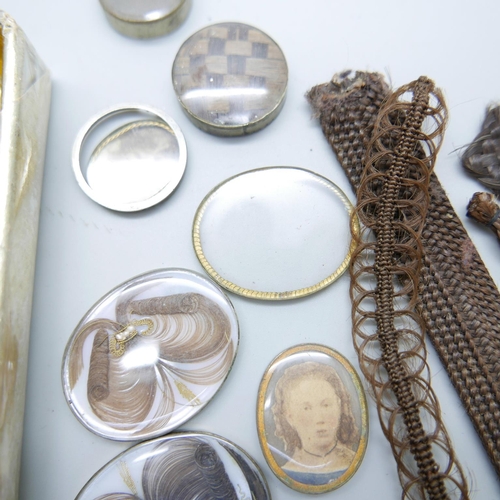 899 - A collection of Victorian brooch inserts, in memory of photographs, hair, etc.