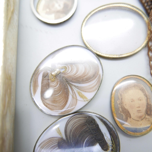 899 - A collection of Victorian brooch inserts, in memory of photographs, hair, etc.