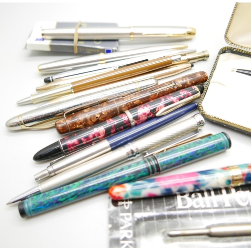 920 - A collection of pens, Parker, a brown marbled Nova pen, nib a/f, rolled gold Cross ballpoint, etc.