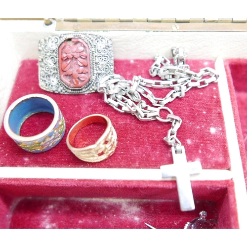 921 - A jewellery box and contents including a silver locket, three chains and ring, and a plated purse