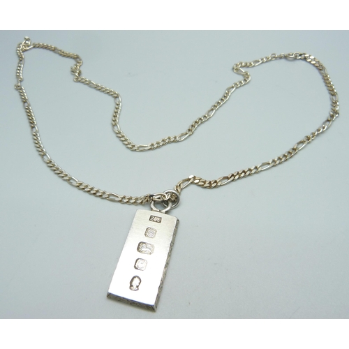 932 - A silver ingot pendant on a silver chain, 39g, chain 59cm