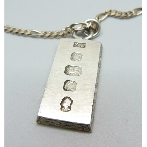 932 - A silver ingot pendant on a silver chain, 39g, chain 59cm