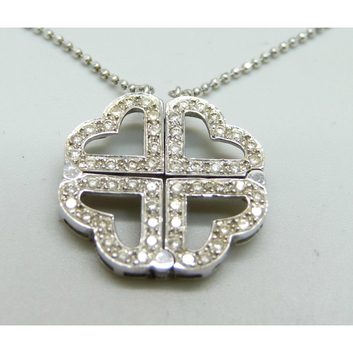 945 - An 18ct white gold and diamond articulated pendant/four heart necklace, 6.2g