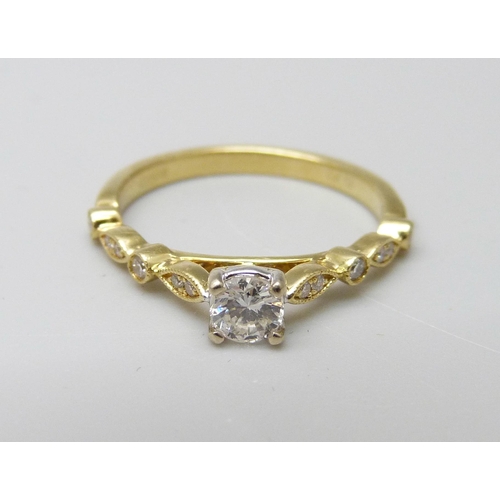 956 - An 18ct gold and diamond ring, 2.6g, M, main stone 0.25ct diamond weight