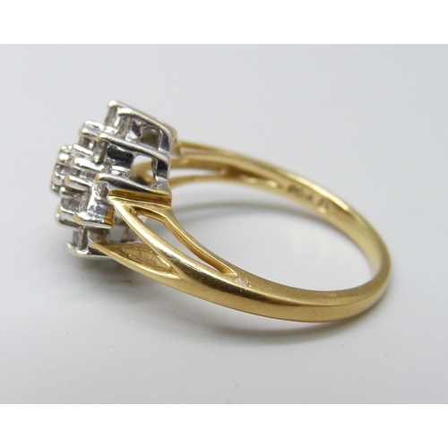 960 - An 18ct gold and diamond cluster ring, 1ct of diamonds marked on the shank, 4.8g, N