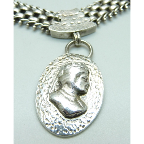 977 - A silver Aesthetic style collarette and pendant, 62g