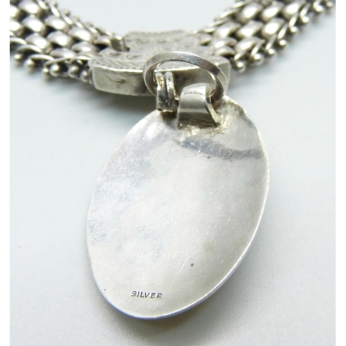 977 - A silver Aesthetic style collarette and pendant, 62g