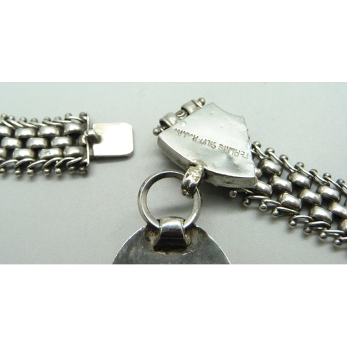 977 - A silver Aesthetic style collarette and pendant, 62g