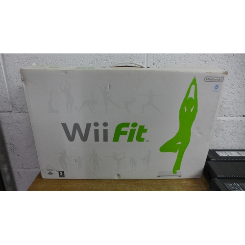 2078A - A box of assorted gaming equipment including XBox 360, games, leads and Wii Fit board