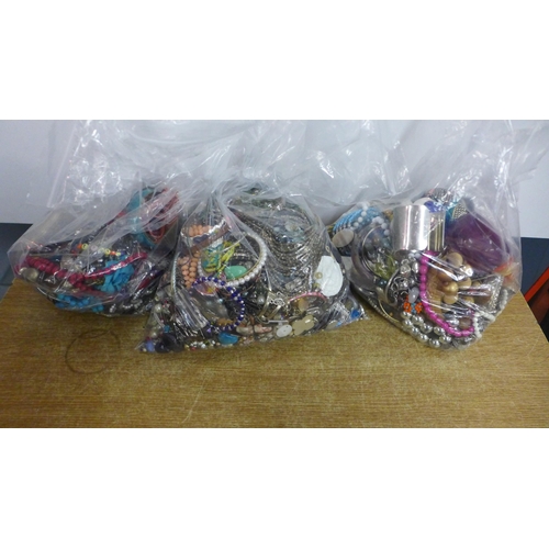 2086 - Three large bags of costume jewellery