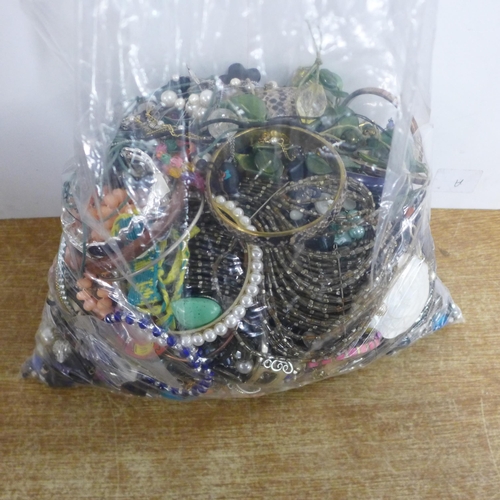 2086 - Three large bags of costume jewellery