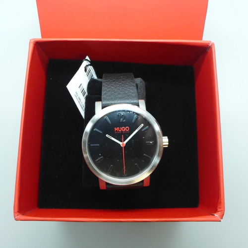 2115 - A men's Hugo Boss wristwatch with black dial, red accents and black leather strap * this lot is subj... 