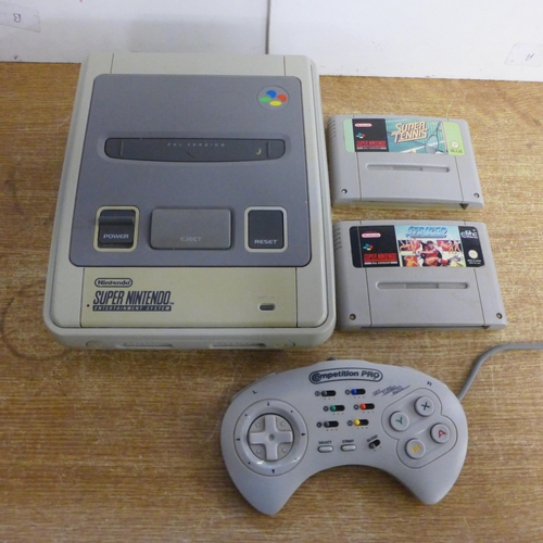 2119 - A Nintendo Super Nintendo Entertainment System console with a controller and two games including Sup... 