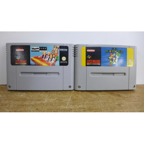 2120 - A Nintendo Super Nintendo Entertainment System console with 2 games; Super Mario World and Theme Par... 