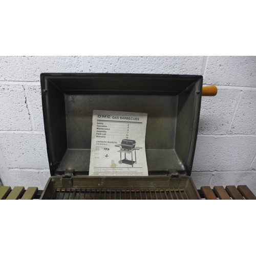 2147 - An OMC Broil King gas barbecue with instruction booklet and a 4.5kg Eurogas gas canister