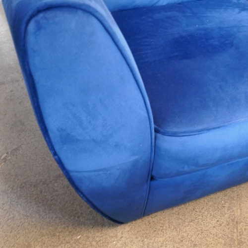 1537 - A blue velvet Hoxton armchair - missing legs