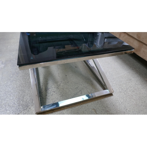 1538 - A Black glass and chrome 'x' base coffee table - Boxed *This lot is subject to VAT