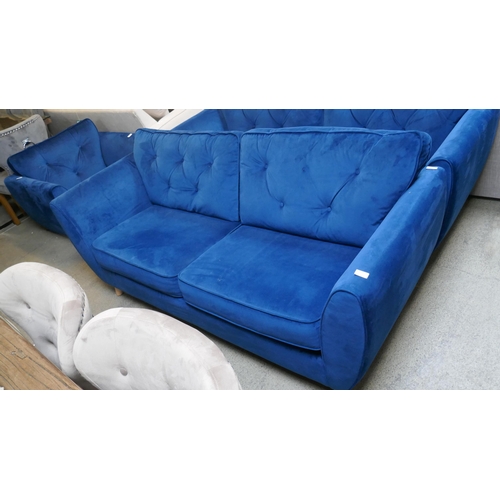 1540 - A blue velvet Hoxton three seater sofa