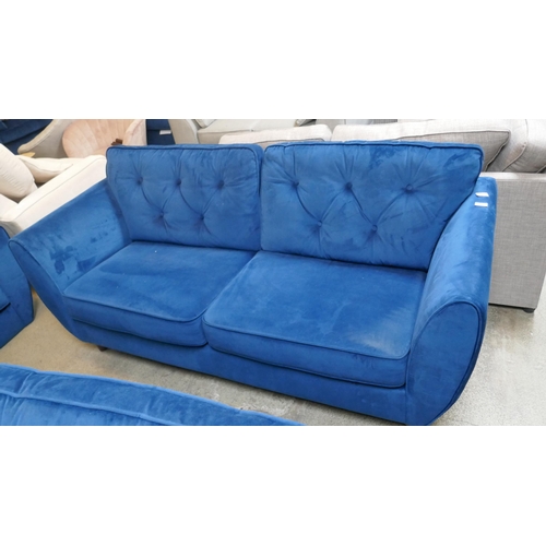 1541 - A blue velvet Hoxton three seater sofa