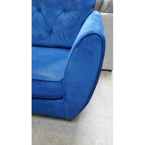 1541 - A blue velvet Hoxton three seater sofa