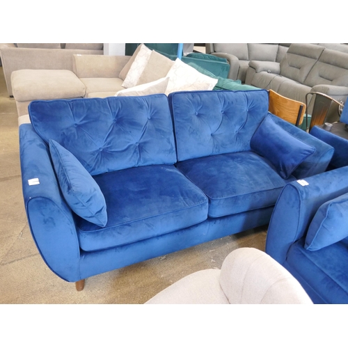 1547 - A blue velvet Hoxton three seater sofa