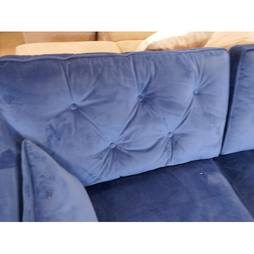 1547 - A blue velvet Hoxton three seater sofa