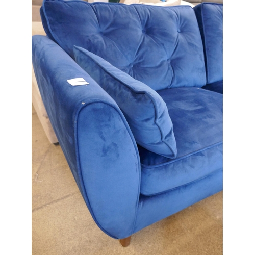 1547 - A blue velvet Hoxton three seater sofa