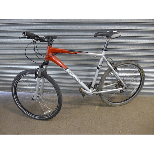 A Giant Boulder front suspension hardtail mountain bike with Shimano gear set and large Aluxx 6000 a