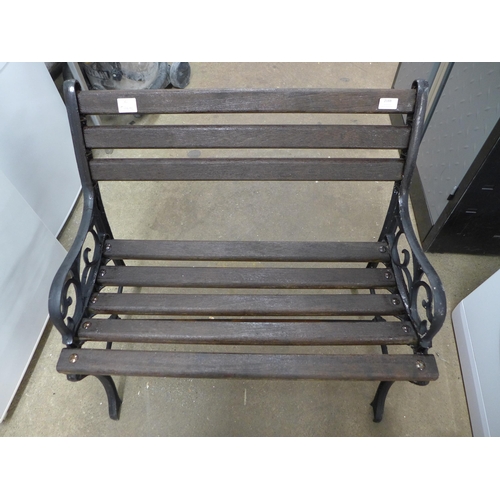 2188 - A small wooden garden bench with cast iron bench ends