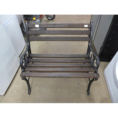 2188 - A small wooden garden bench with cast iron bench ends