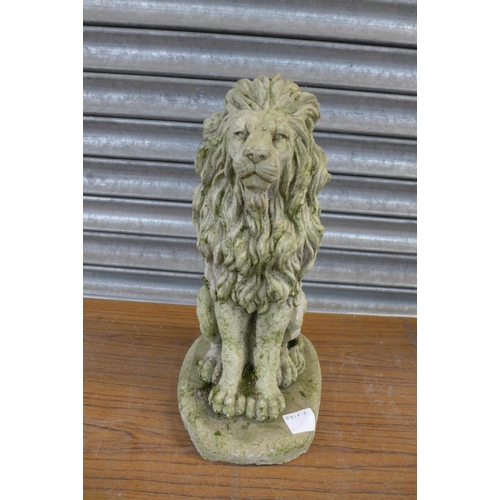 2218 - A pair of concrete garden lion ornaments, approx. 17