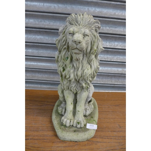 2218 - A pair of concrete garden lion ornaments, approx. 17