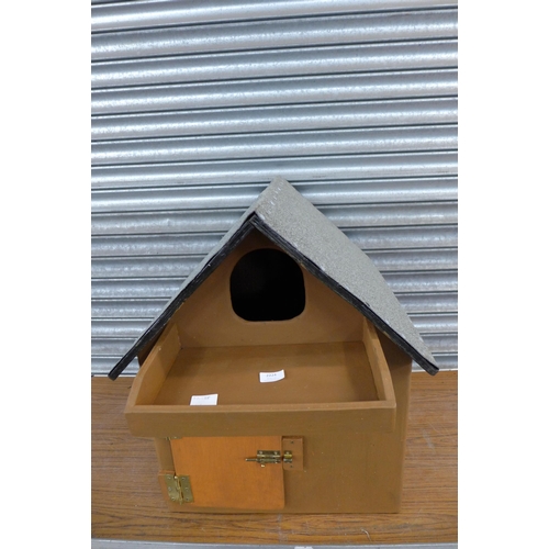 2224 - A wooden painted owl box with felted roof and door with latch