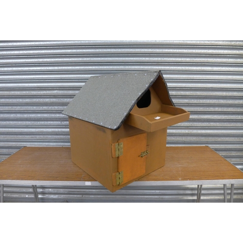 2224 - A wooden painted owl box with felted roof and door with latch