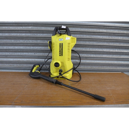 2256 - A Karcher K4 pressure jet wash with hose and lance