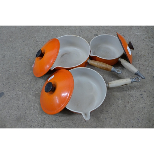 2277 - Three Le Creuset saucepans including an 18cm, 20cm and 22cm saucepan with wooden handles