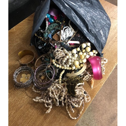 2118 - A large bag of costume jewellery including bracelets, necklaces, earrings, etc.