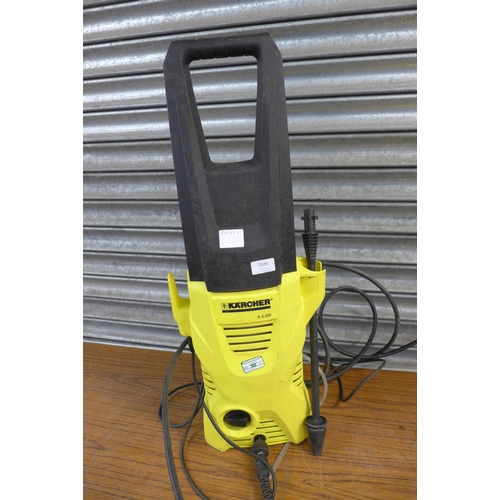 2326 - A Karcher K2.125 pressure washer with hose, lance and patio cleaning attachment