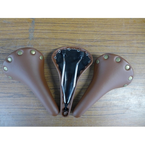 2333 - 3 x Retro”Brooks style” bike saddles in brown faux leather (unused)