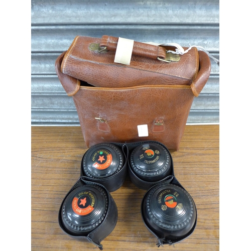 2339 - 4 Greenmaster size 5 lawn bowls with leather case