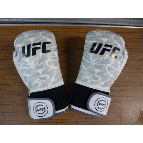 A pair of UFC Ultimate Kombat Pro 14OZ gloves and a Duracell Kayaking bunny