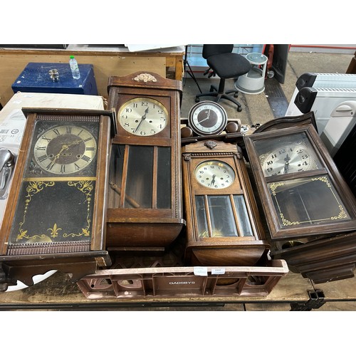 2322 - A collection of five clocks; 4 long cased wall clocks and 1 mantel clock (used)