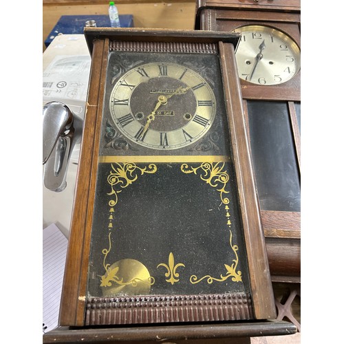 2322 - A collection of five clocks; 4 long cased wall clocks and 1 mantel clock (used)