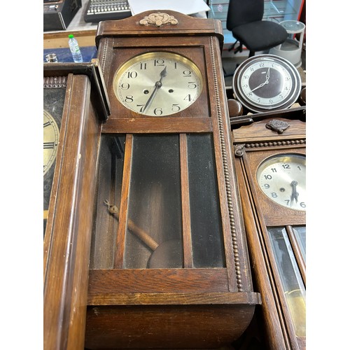 2322 - A collection of five clocks; 4 long cased wall clocks and 1 mantel clock (used)