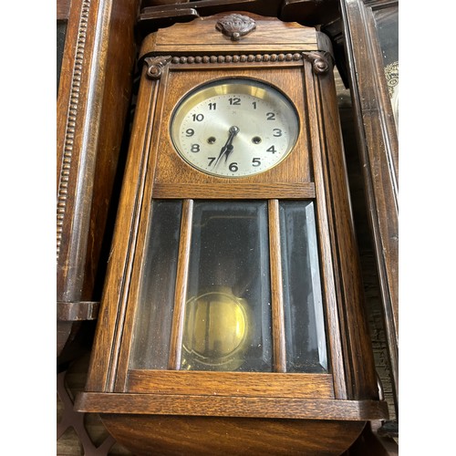 2322 - A collection of five clocks; 4 long cased wall clocks and 1 mantel clock (used)